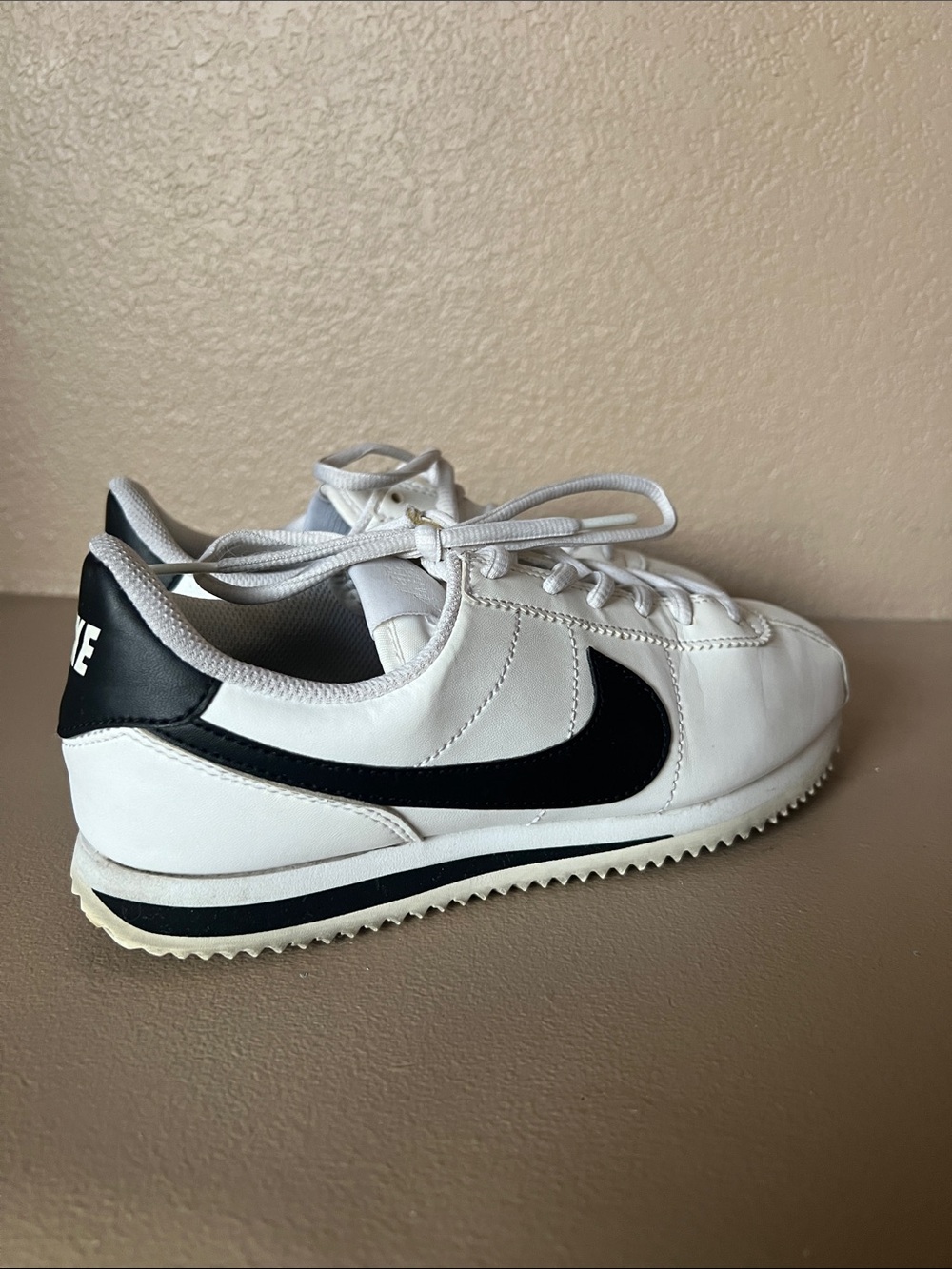 White and black nike cortez